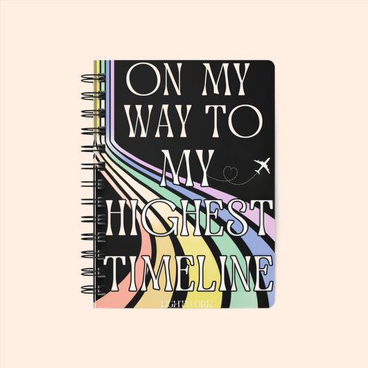 On my way to my highest timeline spiritual manifesting journal with a rainbow graphic.