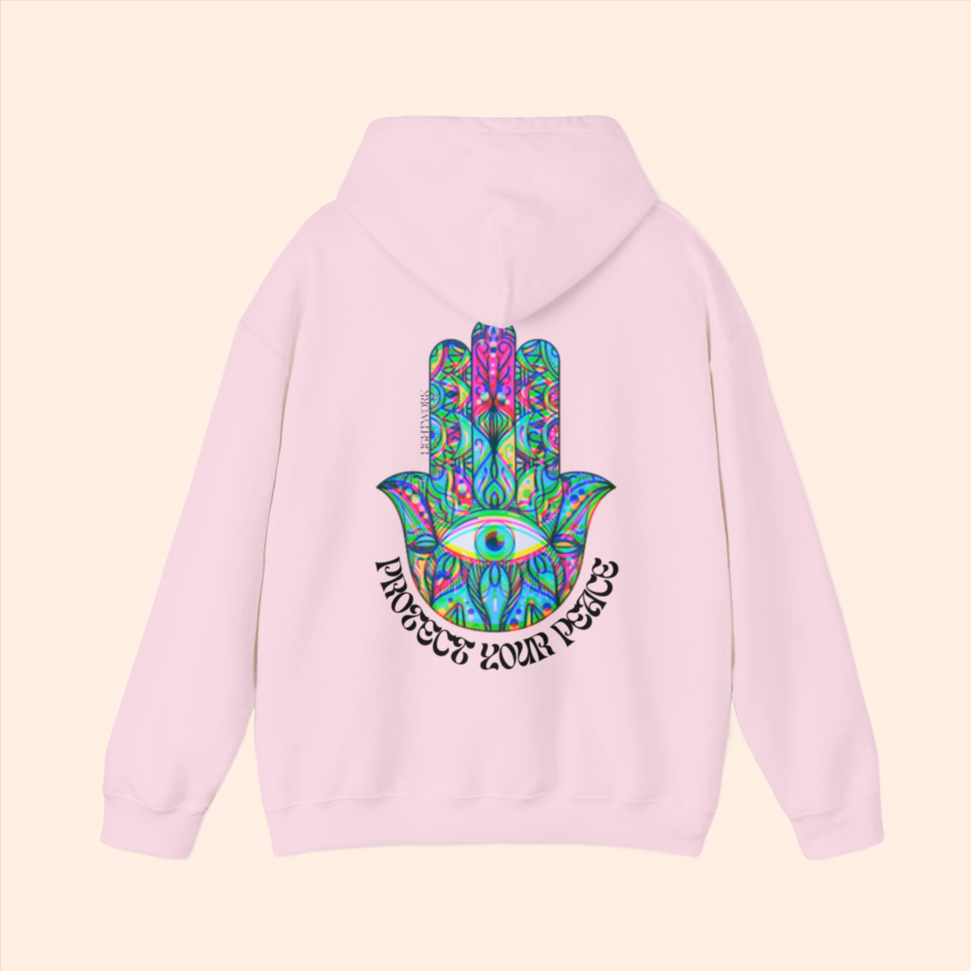 Pink spiritual hoodie. Psychedelic hamsa graphic with "protect your peace" text.