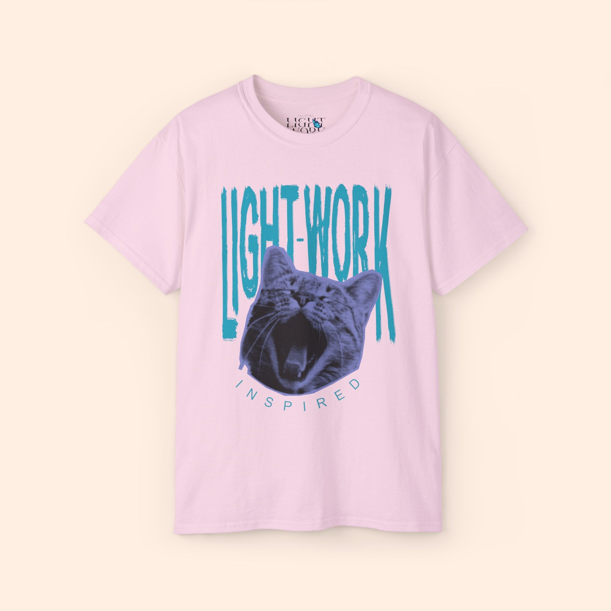 Light pink t-shirt with light blue LIGHT-WORK behind a purple cat graphic.
